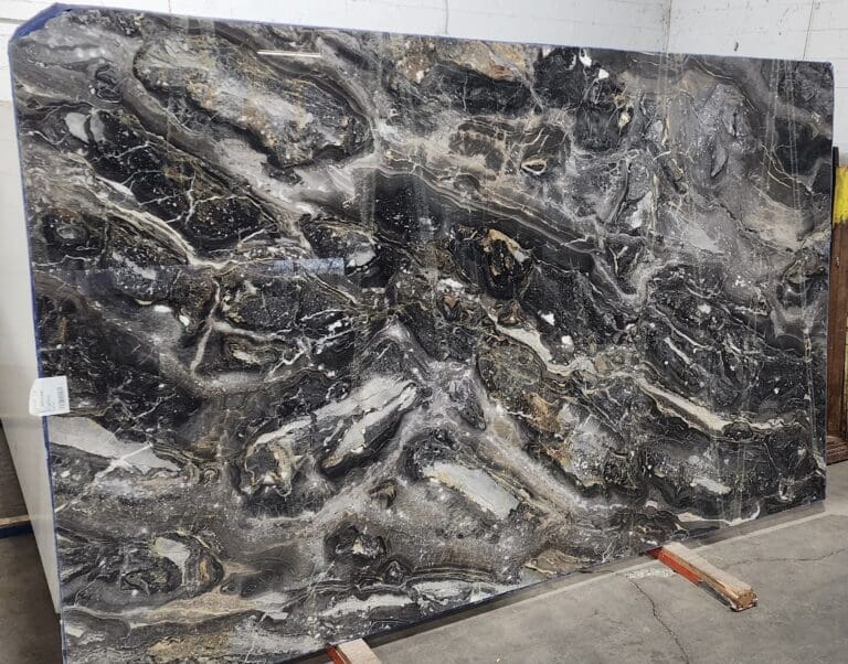 Slab of Arabescato Orobico marble with dramatic black, grey, and beige veining.